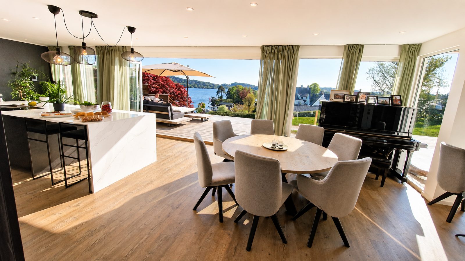 Dining room with kitchen and water views