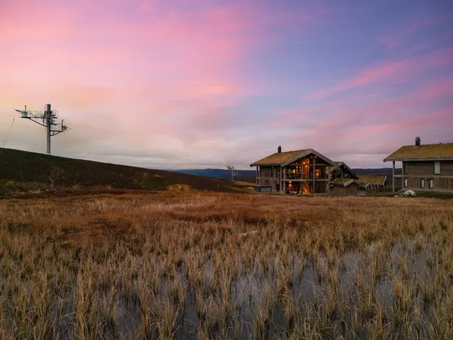 The chalet in the evening mountain landscape